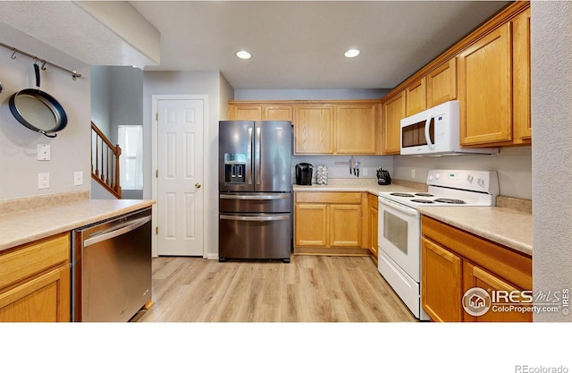 kitchen featuring light hardwood / wood-style flooring and appliances with stainless steel finishes