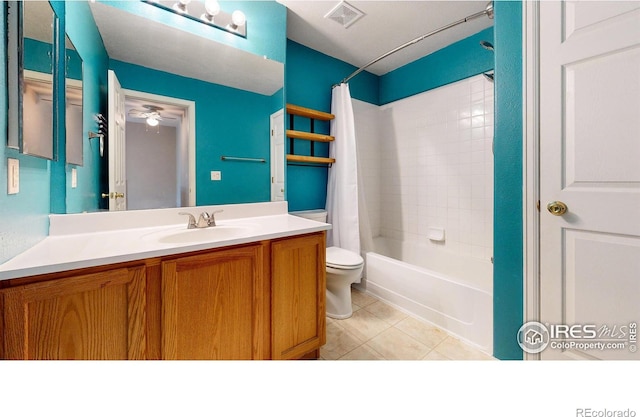 full bathroom with ceiling fan, vanity, shower / bath combination with curtain, tile patterned floors, and toilet