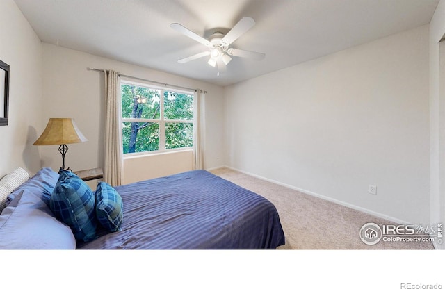 carpeted bedroom featuring ceiling fan