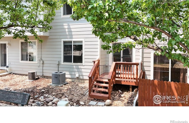 rear view of property with central air condition unit