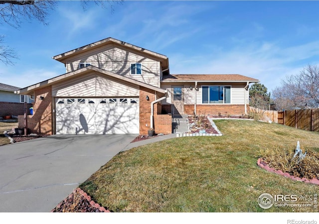 view of front of property with a garage and a front yard