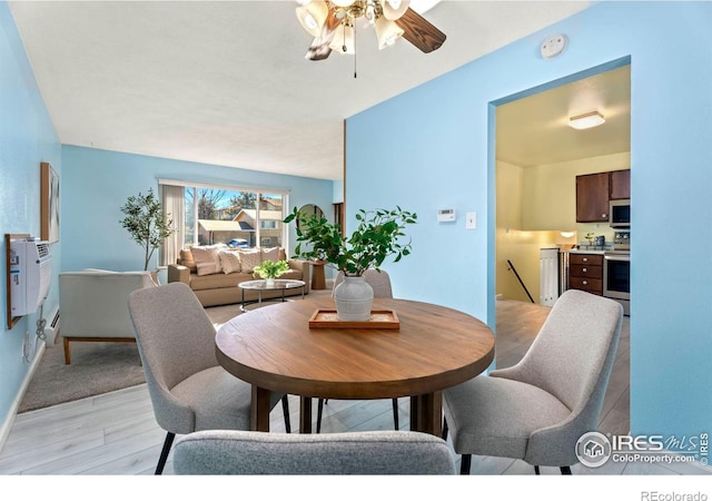 dining area featuring ceiling fan and light hardwood / wood-style floors