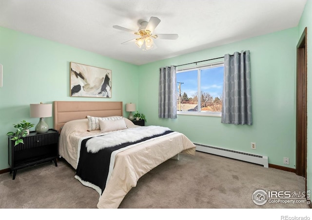 carpeted bedroom featuring ceiling fan and a baseboard heating unit