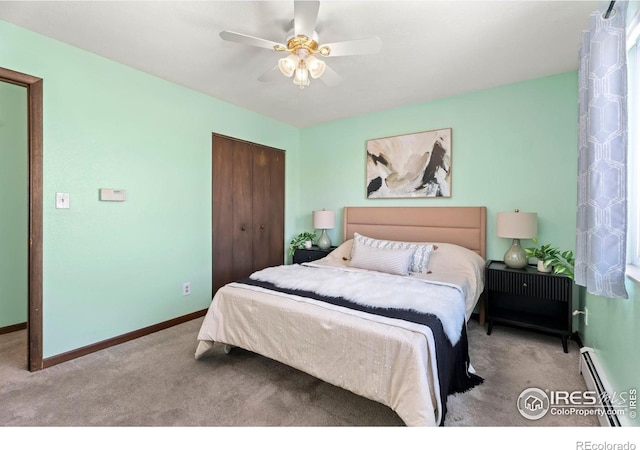 bedroom with light colored carpet, a closet, ceiling fan, and baseboard heating