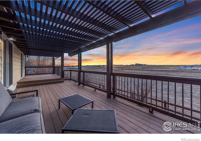 deck at dusk with a pergola