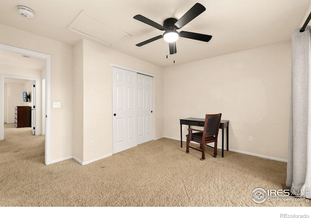 carpeted home office with ceiling fan