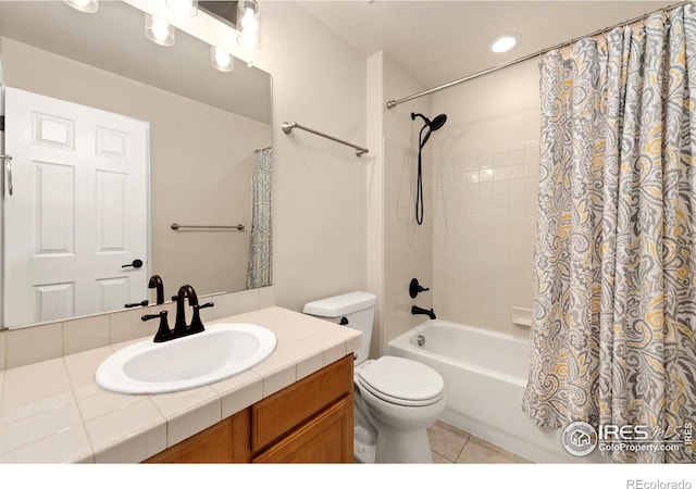 full bathroom with tile patterned flooring, vanity, shower / bathtub combination with curtain, and toilet