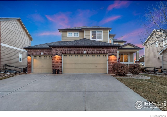 view of front of property with a garage