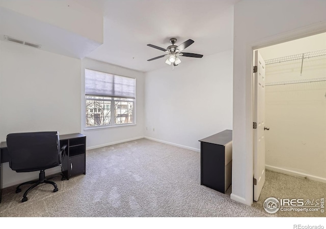 office area with light carpet and ceiling fan