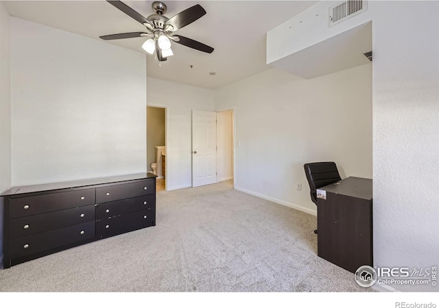 home office featuring light colored carpet and ceiling fan