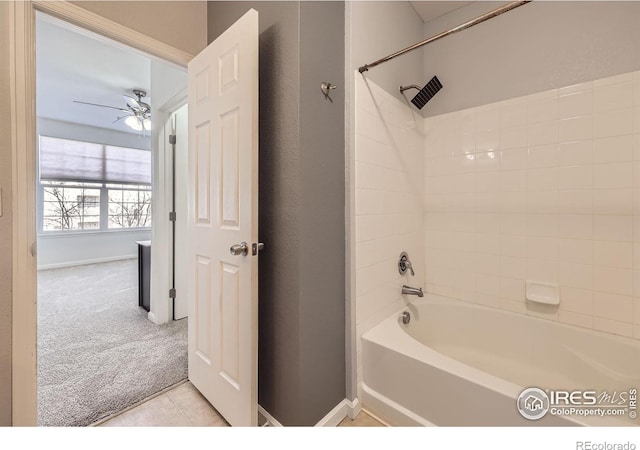 bathroom with shower / bathing tub combination, tile patterned floors, and ceiling fan