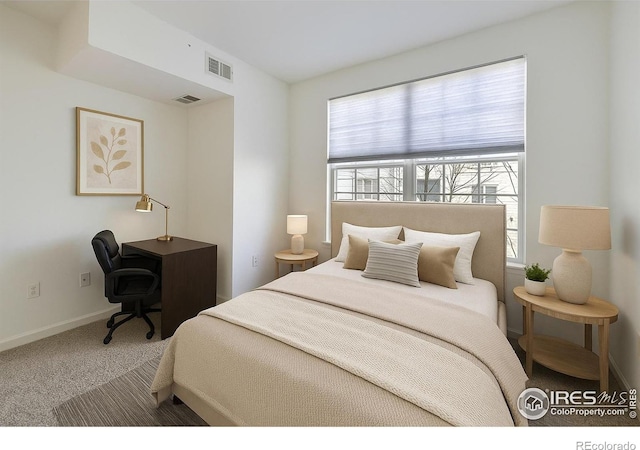 5756 N Genoa Way Unit 205, Aurora, CO 80019 - carpeted bedroom featuring baseboards and an office area