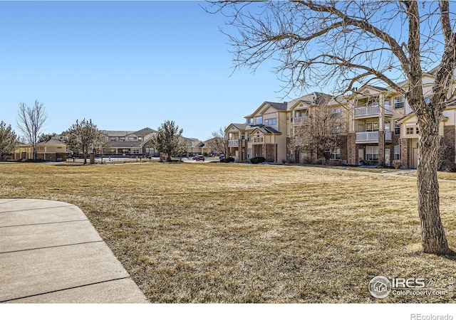 5756 N Genoa Way Unit 205, Aurora, CO 80019 - surrounding community with a residential view and a lawn