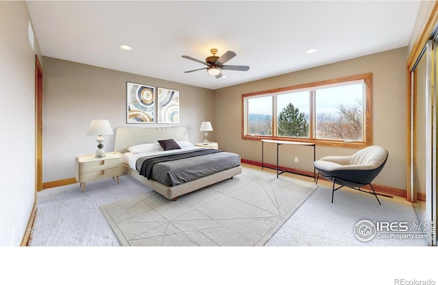 bedroom with ceiling fan and a closet