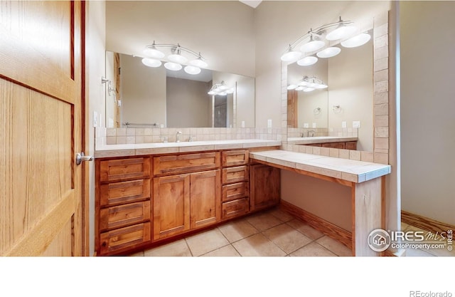 bathroom featuring tile patterned flooring and vanity