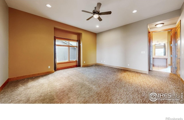 carpeted empty room with ceiling fan