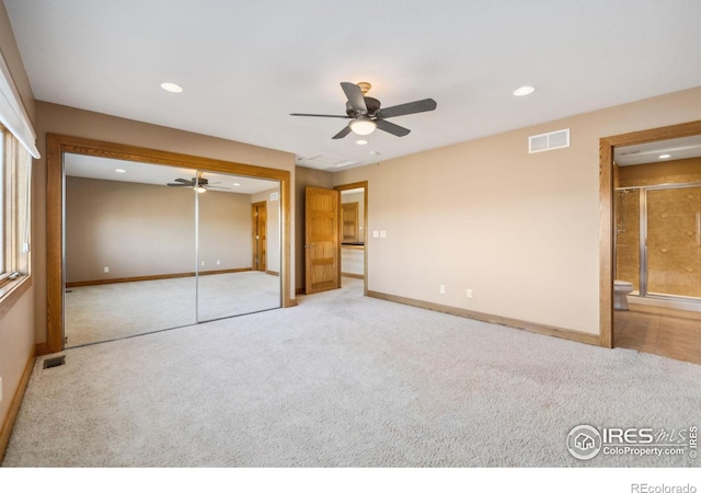 unfurnished bedroom with recessed lighting, carpet, visible vents, and baseboards