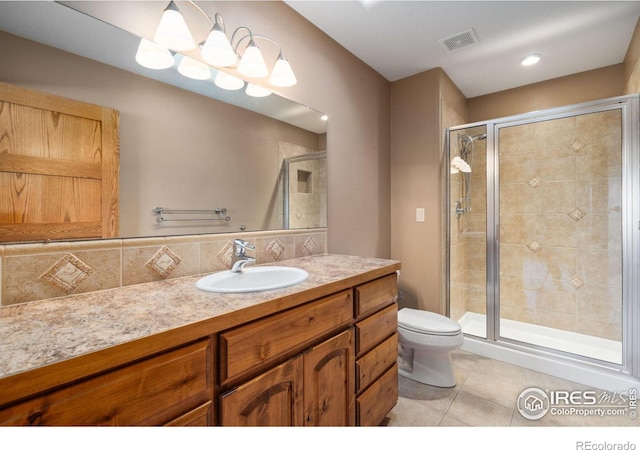 bathroom featuring a stall shower, tile patterned flooring, and visible vents