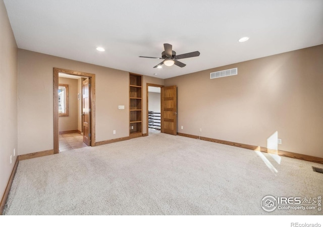 unfurnished bedroom with carpet, visible vents, baseboards, and recessed lighting