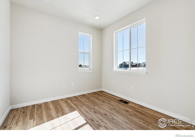 unfurnished room featuring light hardwood / wood-style flooring