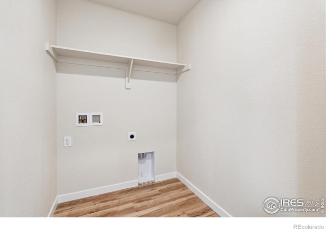 laundry room featuring hookup for a washing machine, hookup for an electric dryer, and light wood-type flooring