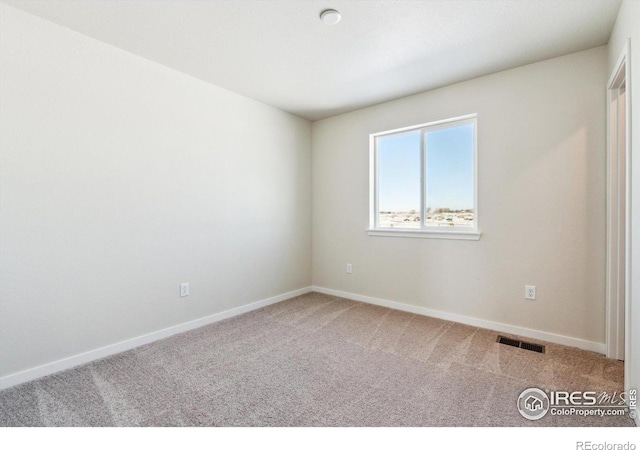 view of carpeted spare room