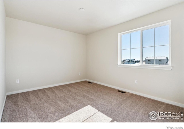 view of carpeted spare room