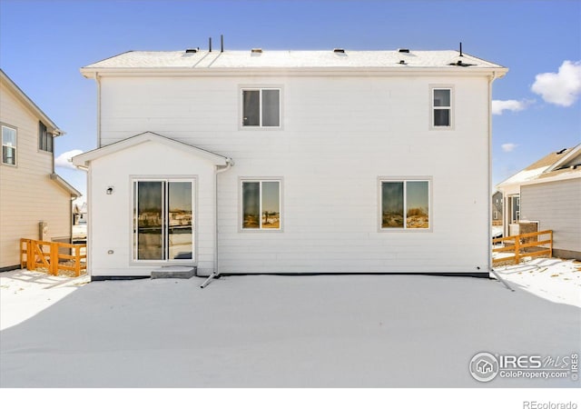 view of snow covered house