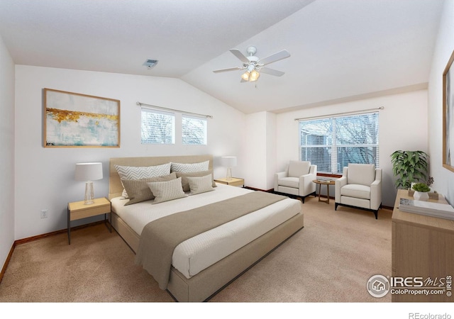 carpeted bedroom with ceiling fan, lofted ceiling, and multiple windows