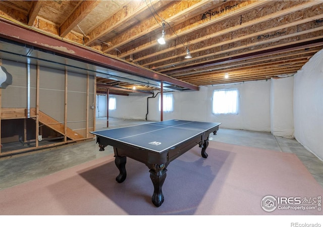 recreation room featuring concrete flooring