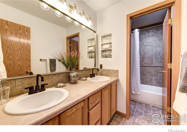 bathroom featuring vanity and shower / bath combination with curtain