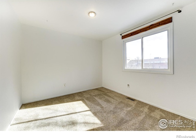 empty room featuring carpet floors