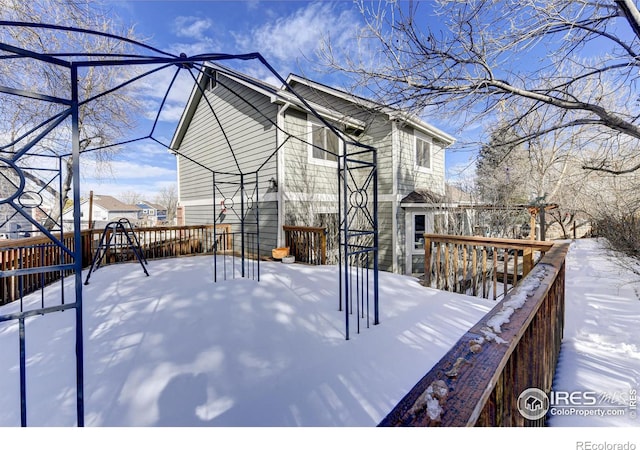 view of snow covered deck