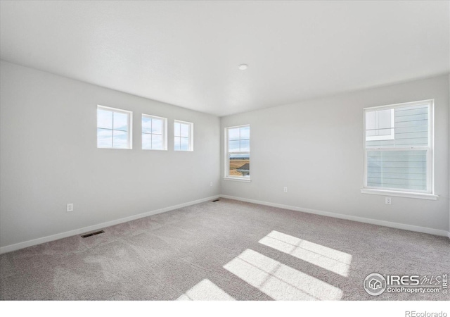 view of carpeted spare room