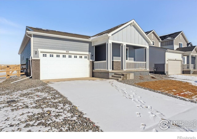 view of front of property with a garage and a porch