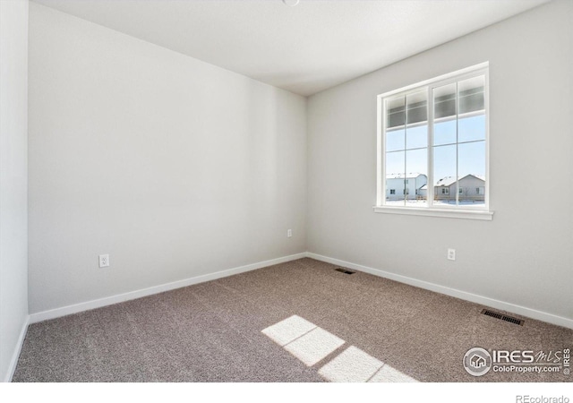 view of carpeted spare room