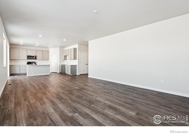 unfurnished living room featuring dark hardwood / wood-style floors