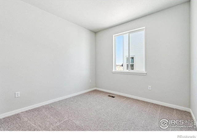 empty room featuring carpet flooring