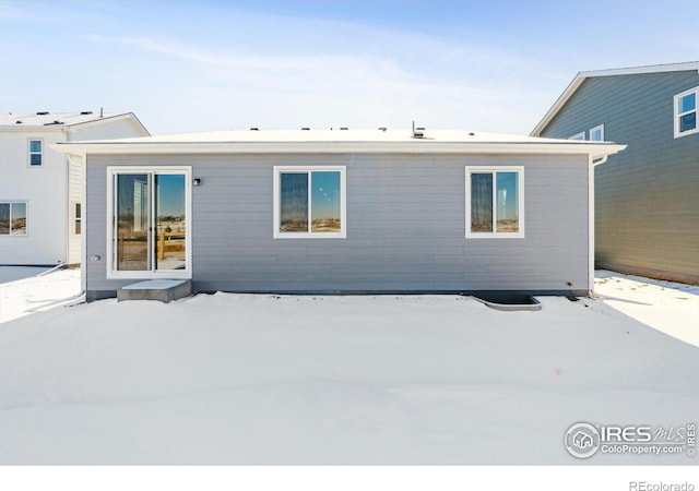 view of snow covered house