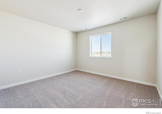 view of carpeted spare room