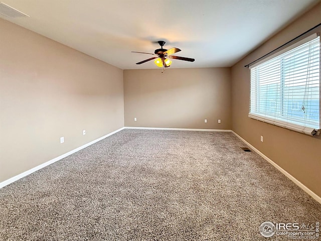 empty room featuring carpet floors and ceiling fan