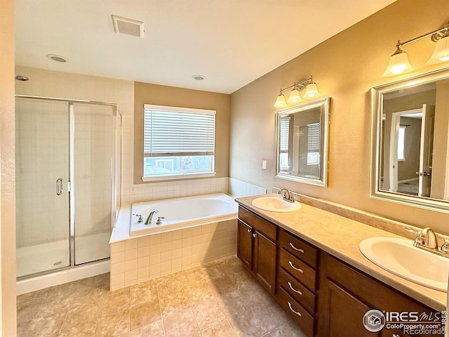 bathroom featuring vanity and separate shower and tub