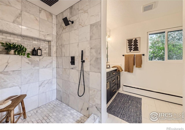 bathroom featuring vanity and a tile shower