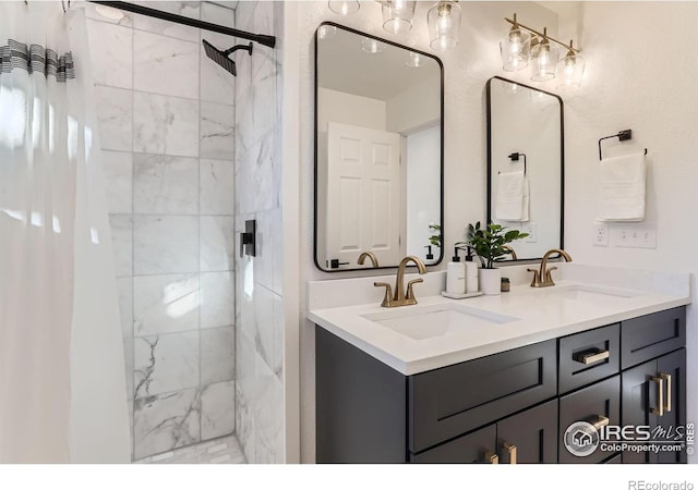 bathroom with vanity and tiled shower