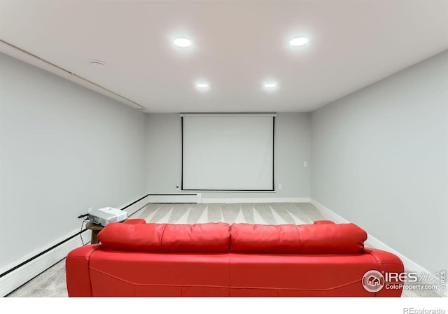 cinema room with a baseboard radiator