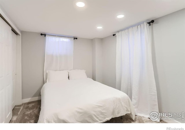 carpeted bedroom with a closet