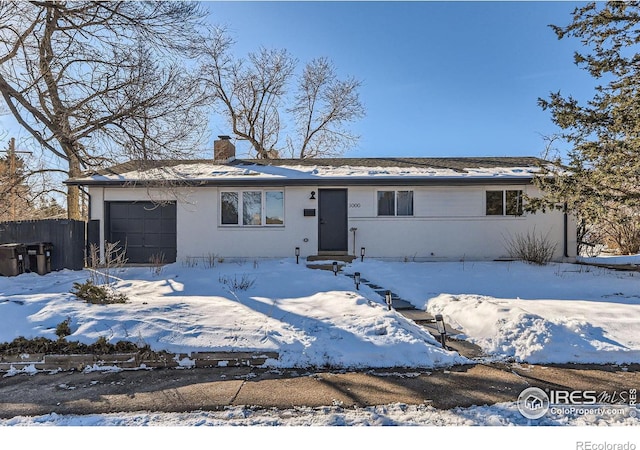 single story home featuring a garage