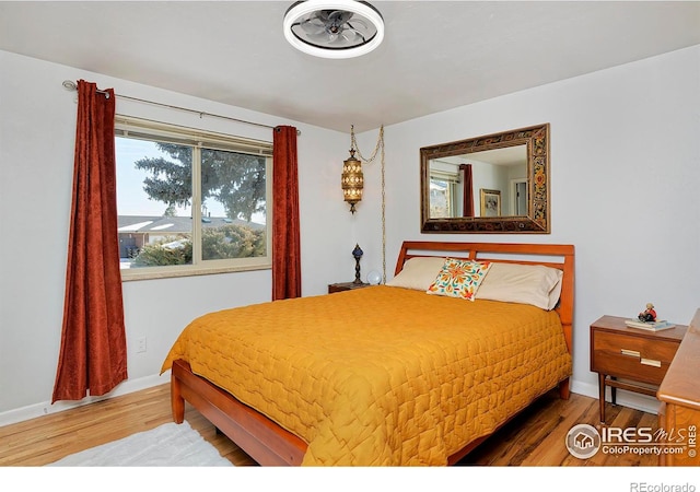 bedroom featuring wood-type flooring