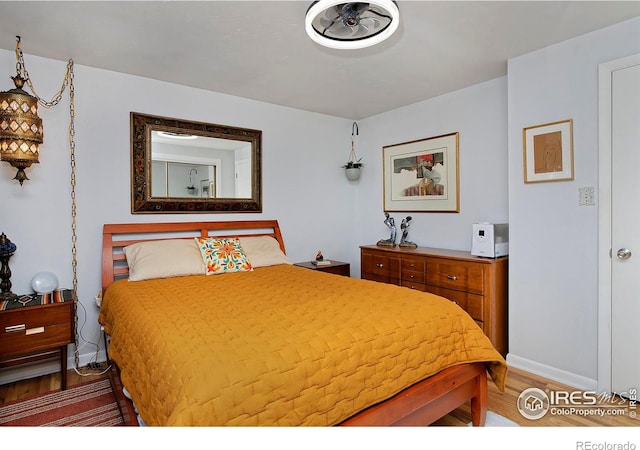 bedroom featuring hardwood / wood-style flooring