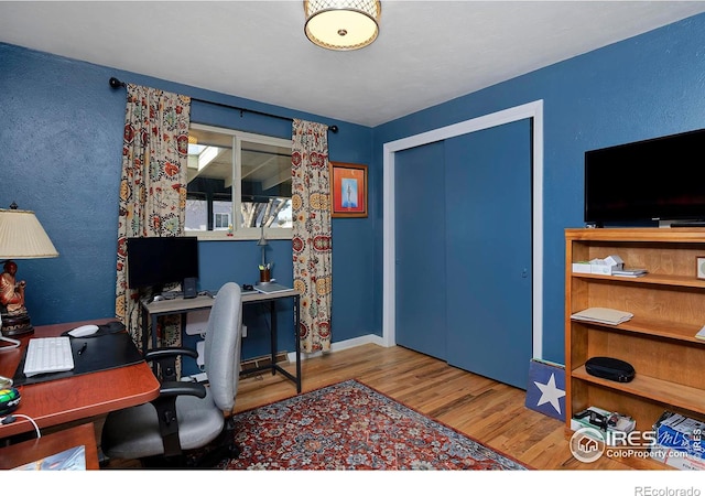 office area with hardwood / wood-style floors